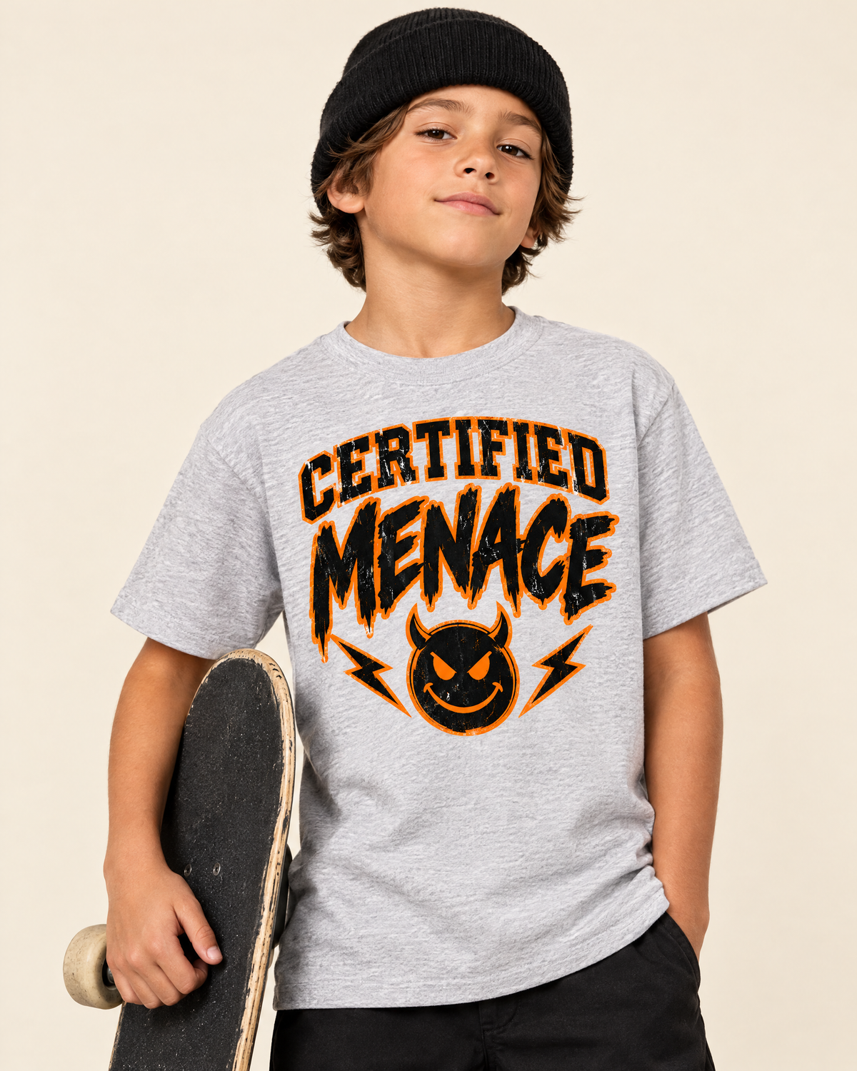 Kid holding a skateboard wearing the Certified Menace tee and black beanie