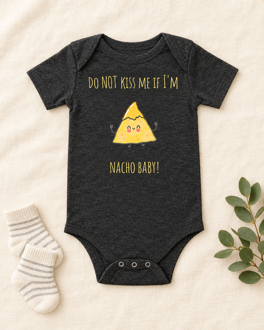 Do Not Kiss Me If I'm Nacho Baby Bodysuit in dark grey heather, flat lay - cute baby bodysuit gift idea, Cartsy