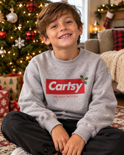 Boy wearing the sport grey Cartsy box logo holiday edition kids Christmas sweatshirt
