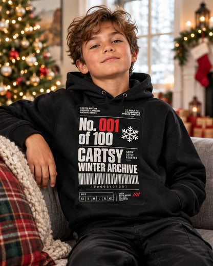 Kid wearing the black Cartsy Winter Archive No. 001 kids hoodie with a sneaker hang-tag graphic