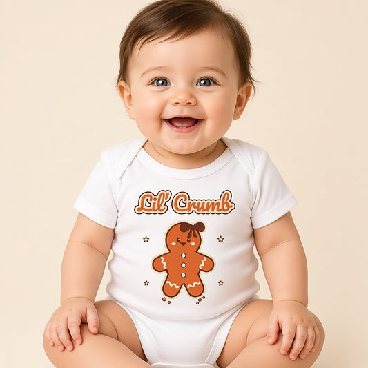 Baby in a white Lil' Crumb gingerbread Christmas bodysuit