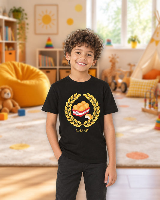 Kid wearing the black Chicken Nugget Champ tee in a bright playroom