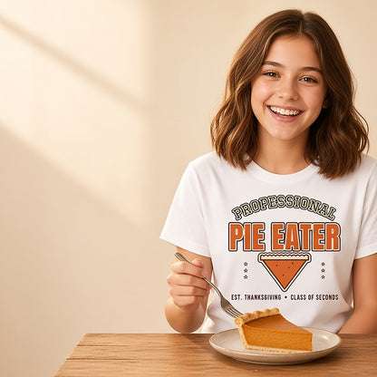 Girl in the Professional Pie Eater kids Thanksgiving shirt with a slice of pumpkin pie