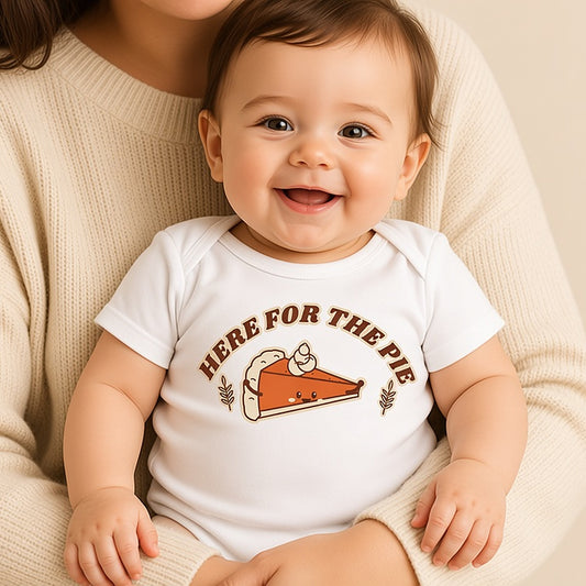 Parent holding a baby in the Here for the Pie pumpkin pie Thanksgiving bodysuit