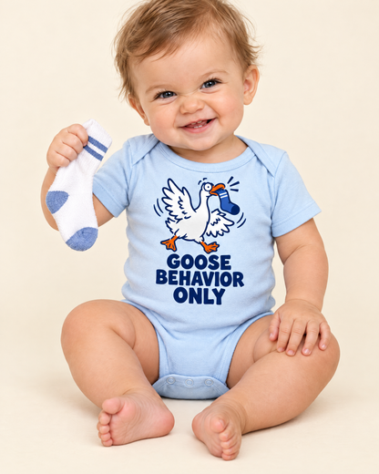 Baby holding a sock wearing the Goose Behavior Only bodysuit