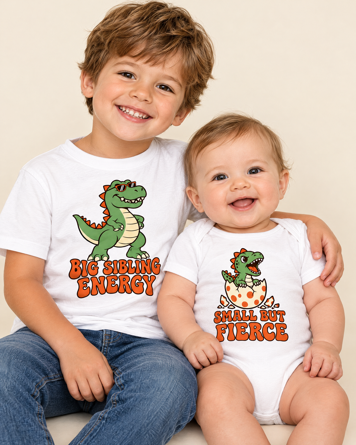 Big sibling in Big Sibling Energy tee holding baby in Small But Fierce bodysuit