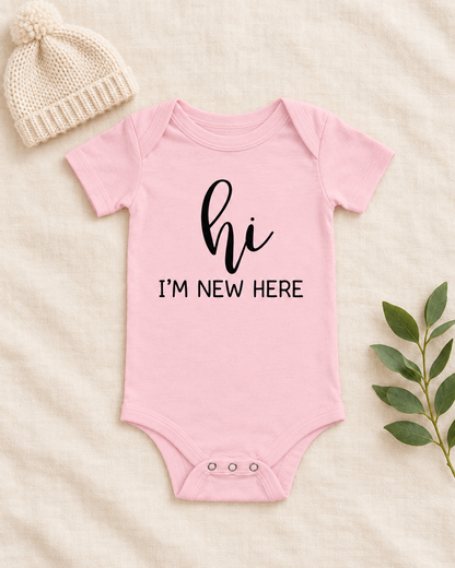 Hi I'm New Here Newborn Baby Bodysuit in pink, flat lay - cute baby bodysuit gift idea, Cartsy