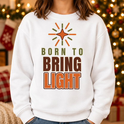 Child wearing the Modern Christian Kids Sweatshirt: Born to Bring Light Bold in a cozy Christmas living room, cropped torso view