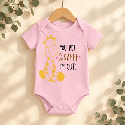 You Bet Giraffe I'm Cute Baby Bodysuit in Pink on a wooden hanger - Cartsy