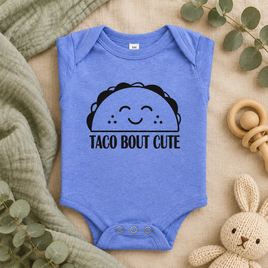Taco 'Bout Cute Baby Bodysuit in Heather Columbia Blue, folded flat lay - Cartsy