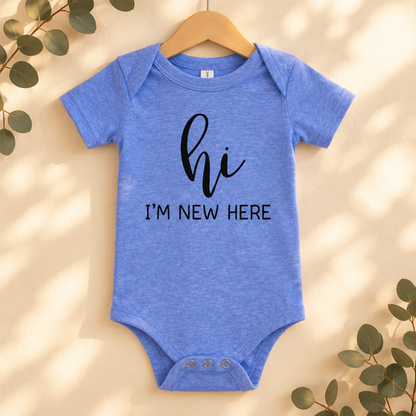 Hi I'm New Here Newborn Baby Bodysuit in Heather Columbia Blue on a wooden hanger - Cartsy