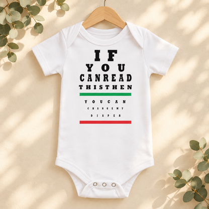 If You Can Read This Eye Chart Baby Bodysuit in White on a wooden hanger - Cartsy