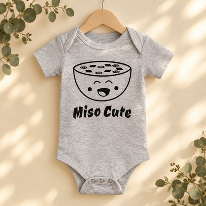 Miso Cute Baby Bodysuit in Athletic Heather on a wooden hanger - Cartsy