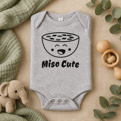 Miso Cute Baby Bodysuit in Athletic Heather, folded flat lay - Cartsy