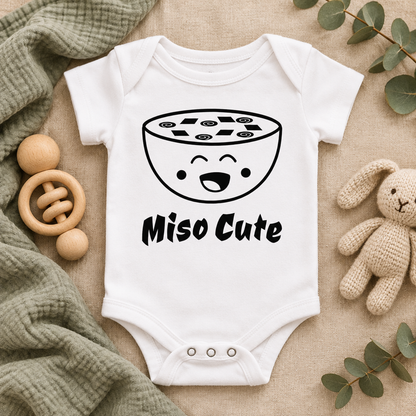 Miso Cute Baby Bodysuit in White, folded flat lay - Cartsy