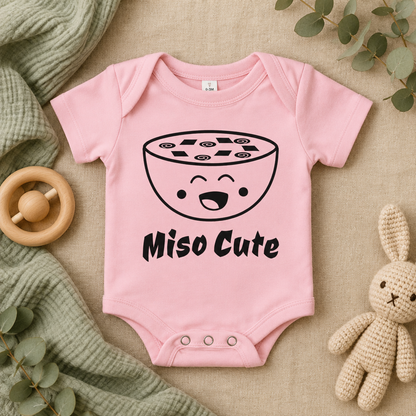 Miso Cute Baby Bodysuit in Pink, folded flat lay - Cartsy