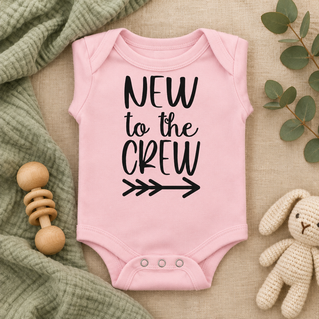 New to the Crew Baby Bodysuit in Pink, folded flat lay - Cartsy