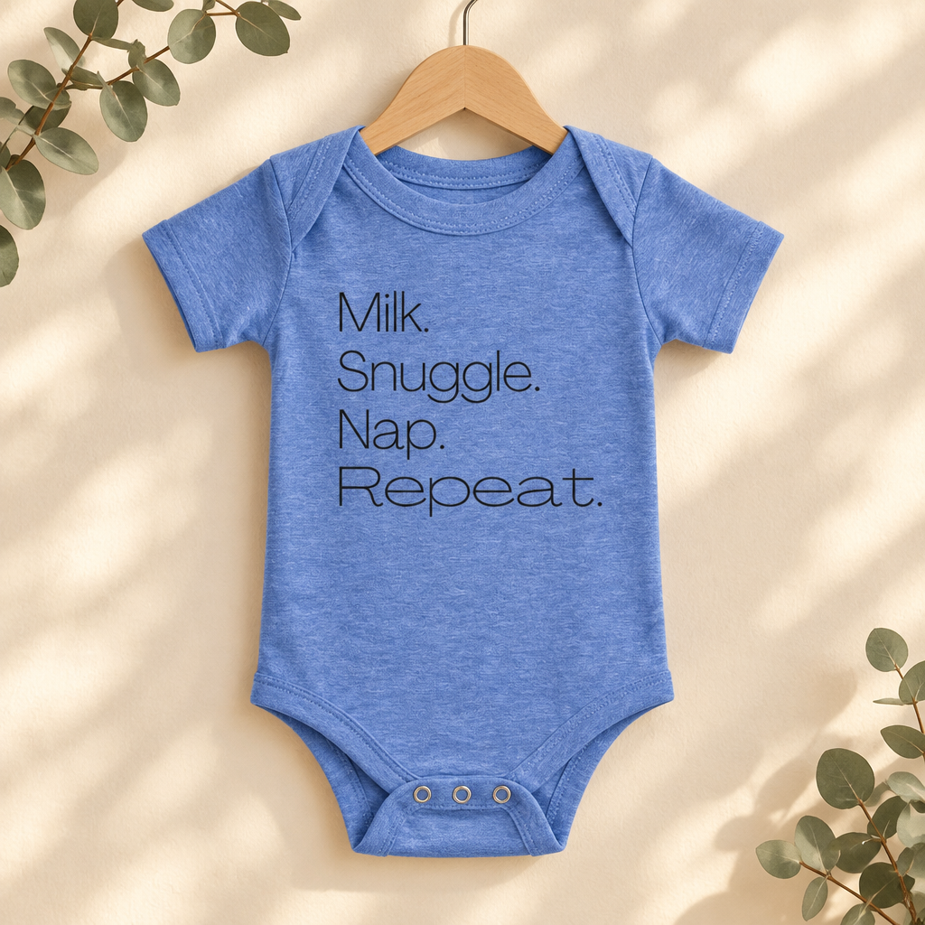 Milk Snuggle Nap Repeat Baby Bodysuit in Heather Columbia Blue on a wooden hanger - Cartsy
