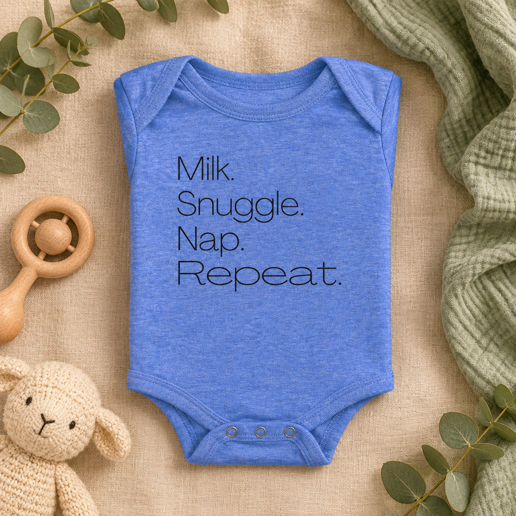 Milk Snuggle Nap Repeat Baby Bodysuit in Heather Columbia Blue, folded flat lay - Cartsy