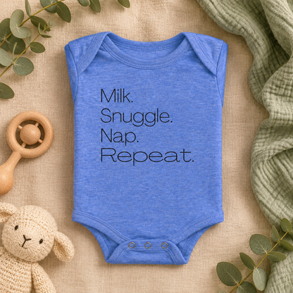 Milk Snuggle Nap Repeat Baby Bodysuit in Heather Columbia Blue, folded flat lay - Cartsy