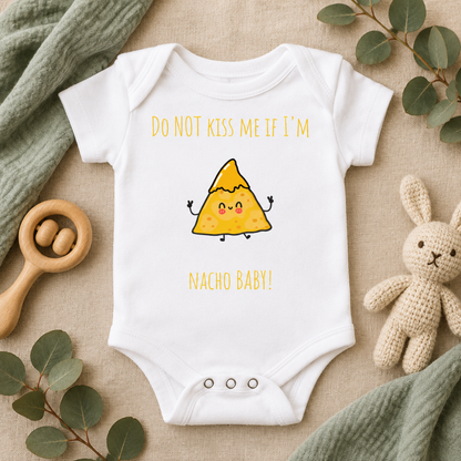 Do Not Kiss Me If I'm Nacho Baby Bodysuit in White, folded flat lay - Cartsy
