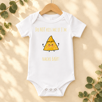 Do Not Kiss Me If I'm Nacho Baby Bodysuit in White on a wooden hanger - Cartsy