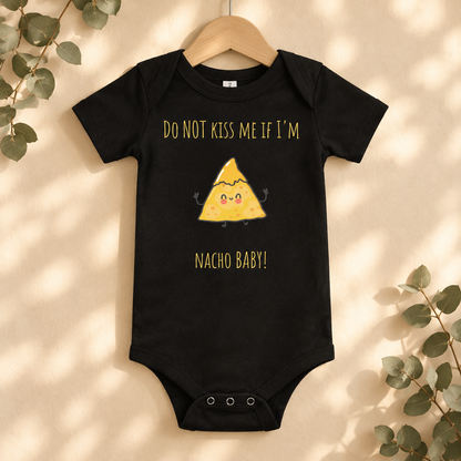 Do Not Kiss Me If I'm Nacho Baby Bodysuit in Black on a wooden hanger - Cartsy