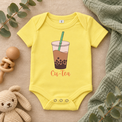 Cu-Tea Boba Tea Baby Bodysuit in Yellow, folded flat lay - Cartsy