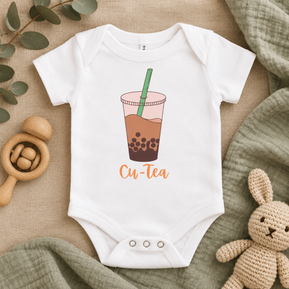 Cu-Tea Boba Tea Baby Bodysuit in White, folded flat lay - Cartsy