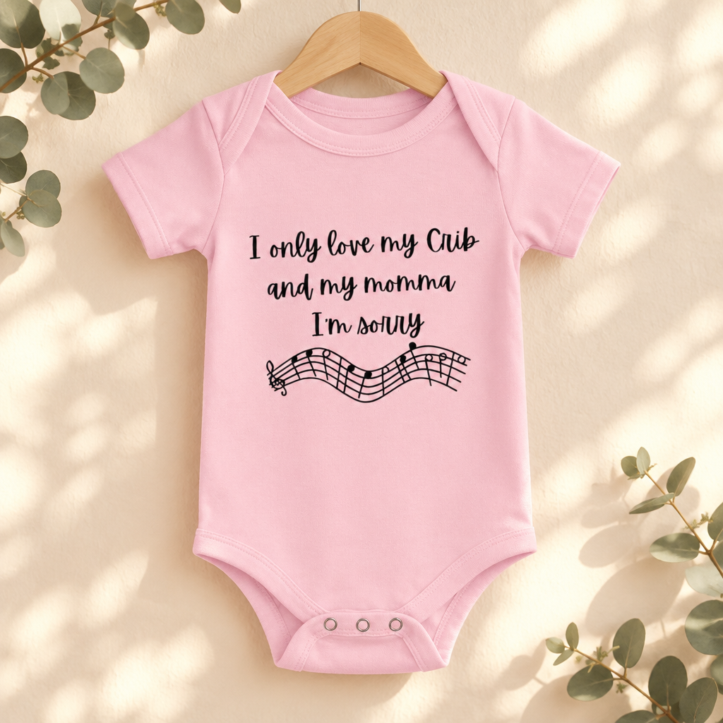 I Only Love My Crib and My Momma Baby Bodysuit in Pink on a wooden hanger - Cartsy
