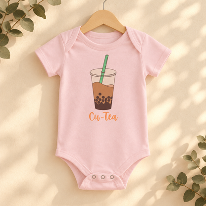 Cu-Tea Boba Tea Baby Bodysuit in Pink on a wooden hanger - Cartsy