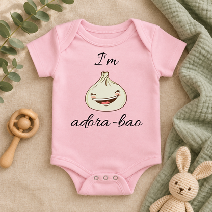 I'm Adora-Bao Dumpling Baby Bodysuit in Pink, folded flat lay - Cartsy