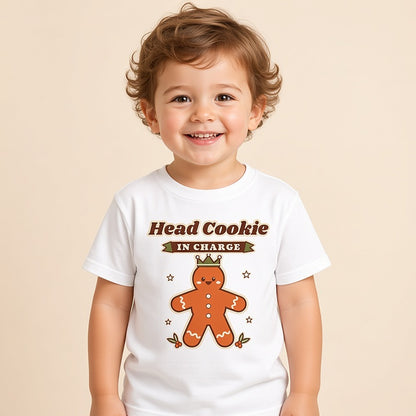 Toddler in a white Head Cookie in Charge gingerbread Christmas tee