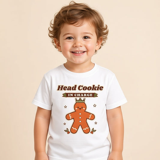 Toddler in a white Head Cookie in Charge gingerbread Christmas tee