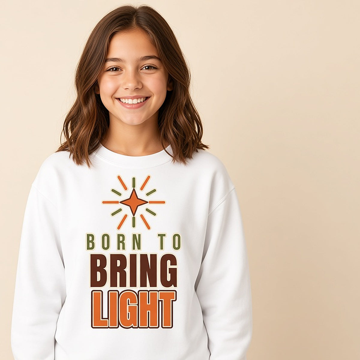 Girl in the white Born to Bring Light bold Christian kids sweatshirt with a radiant star