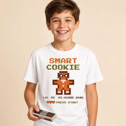 Boy holding a game controller in the white Smart Cookie retro arcade kids Christmas shirt