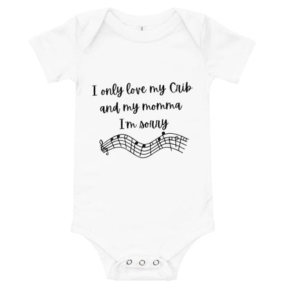 White baby bodysuit with 'I only love my Crib and my momma I'm sorry' above a line of music notes